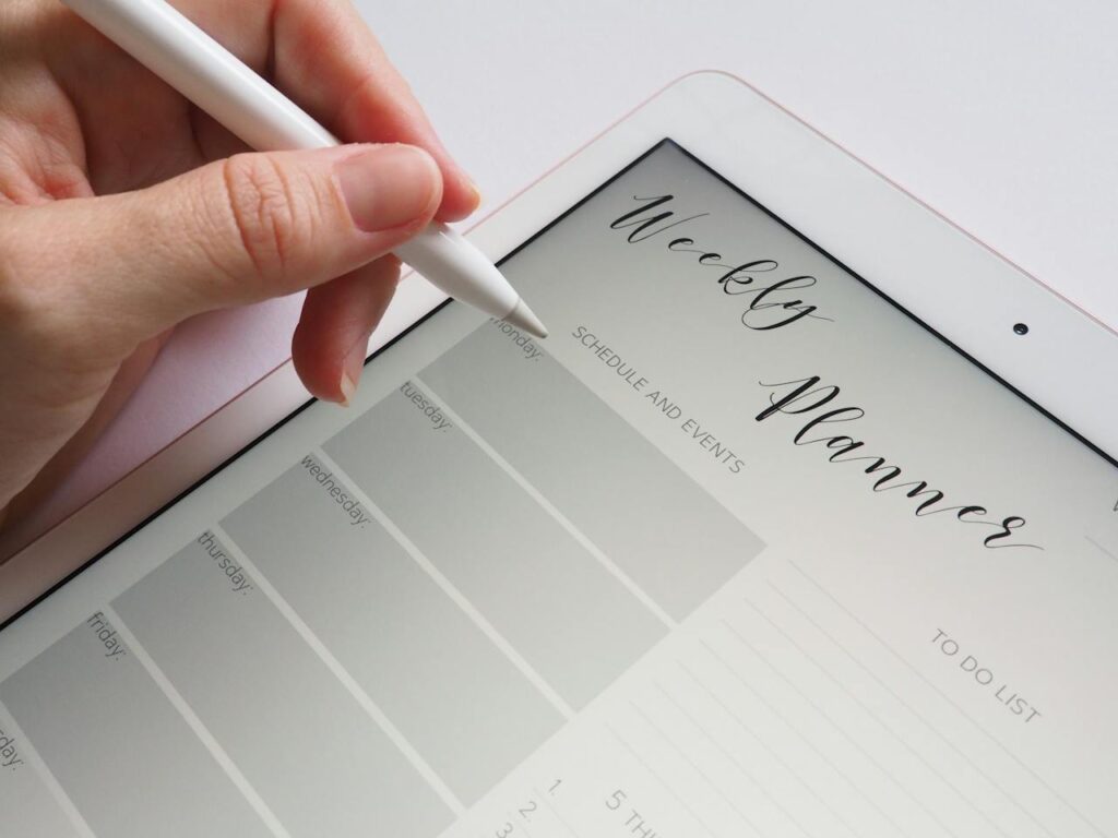 a weekly planner opened on a screen: how to get motivated