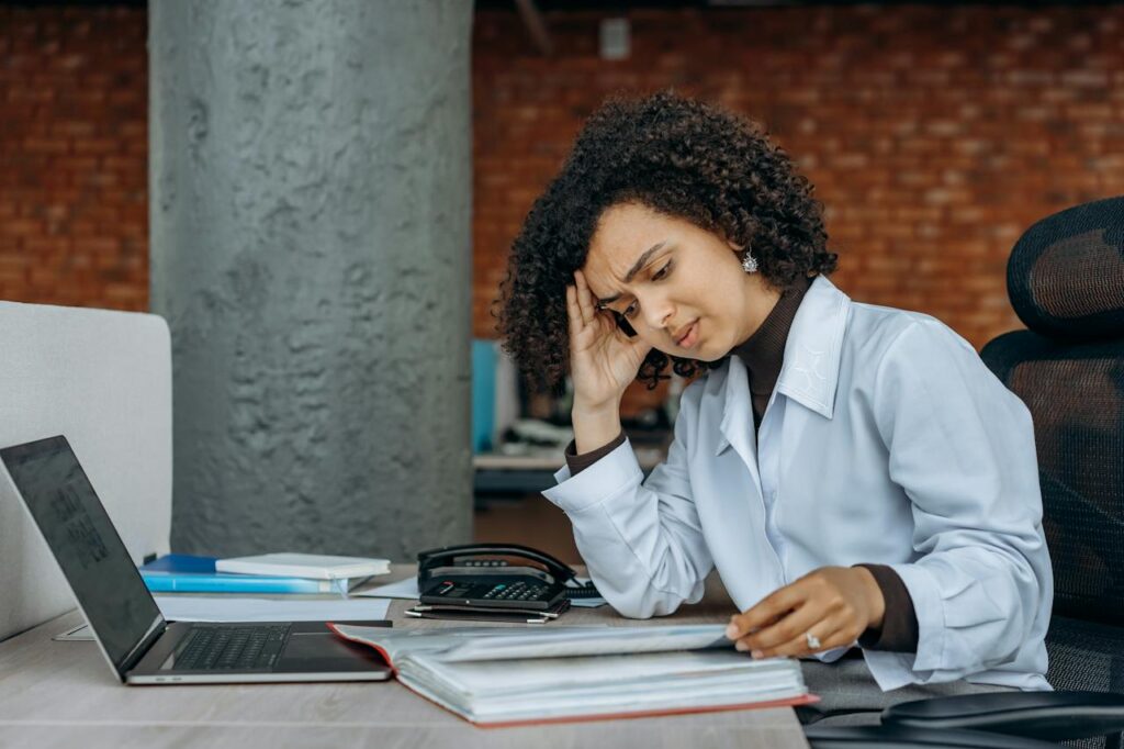 a lady stressed looking at a book: how to get motivated